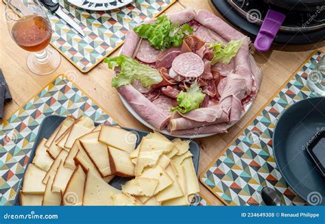 Raclette Cheese and Meat, French Tradition Stock Photo - Image of swiss, cuisine: 234649308