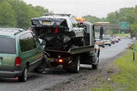 Police car is hit after cop tends to accident on Garden State Parkway ...