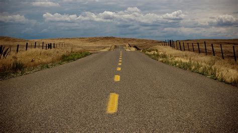 Empty Two Lane Highway by Erik Lykins