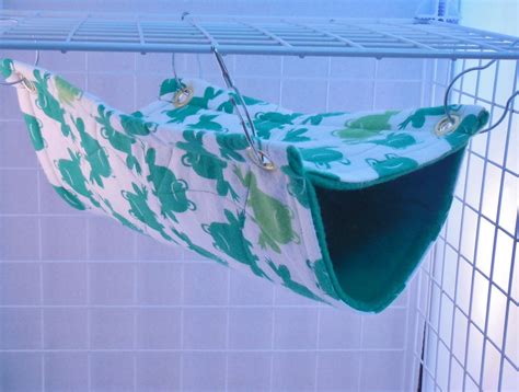 a green and white bag hanging from a wire