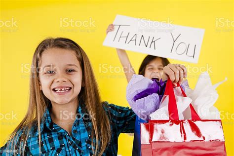 Two Happy Elementary Age Girls Shopping Holding Thank You Sign Stock ...