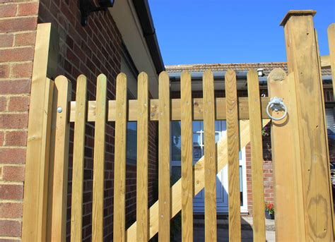 Mitre Topped Wooden Palisade Gates | Jacksons Fencing