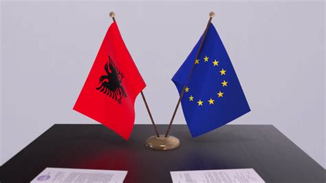 Albania and EU flag on table. Politics deal or business agreement with country 3D animation ...