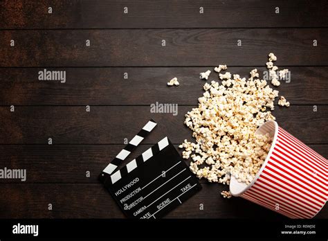 Full popcorn bucket on a dark background Stock Photo - Alamy