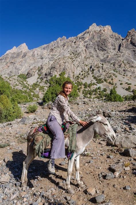 Woman Riding On Donkey In The Mountain Stock Photo - Image: 51407102