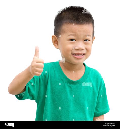 Asian child giving thumb up. Portrait of young boy isolated on white background Stock Photo - Alamy