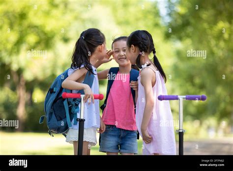 Happy children playing outdoors Stock Photo - Alamy