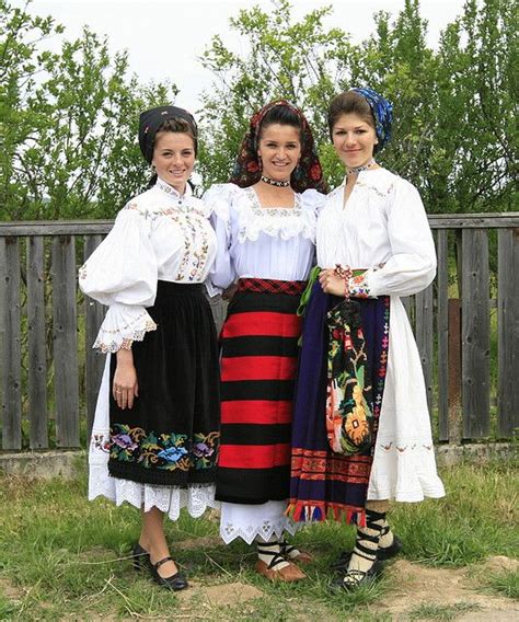 Dames posing in traditional Romanian folk costumes from Maramureş ...