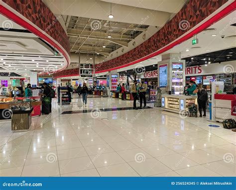 Dubai, UAE - March 02, 2022: in the Terminal of Dubai Airport, People ...