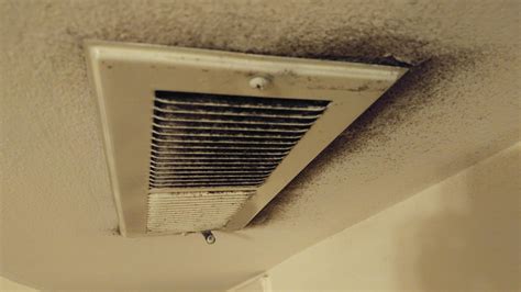 Is this mold on my apartment's air vent? We also burn a lot of incense. Black material is dry to ...