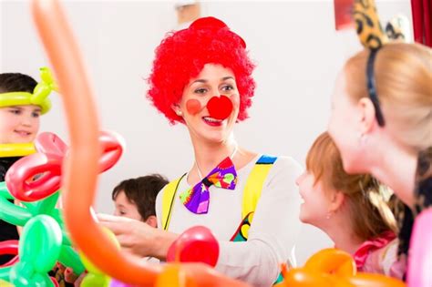 Premium Photo | Clown at children birthday party entertaining the kids