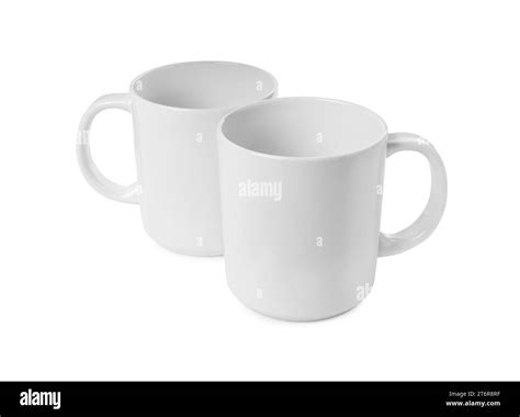 Two light ceramic mugs isolated on white Stock Photo - Alamy