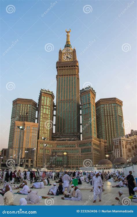 Abraj Al Bait Tower in Mecca, Saudi Arabia. Royal Clock Tower, Blue Sky Scenery and Pilgrims ...