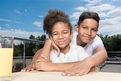 Adorable African-american Kids Embracing Stock Photo - Image of lovely, clouds: 129192158