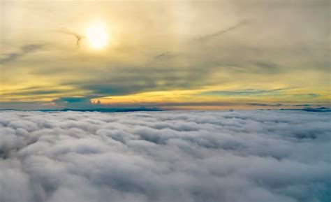 Premium Photo | Aerial view of colorful sunrise over white dense fog ...