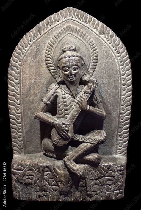 Ancient statue of Narada - heavenly musician in hindu temple in Patan ...