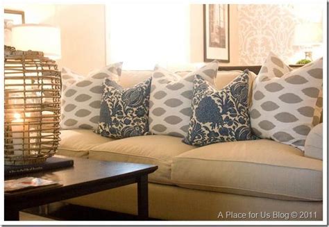 Nice updated pillows mixing the grey and blue for a beige couch. #designsforlivingroom (With ...