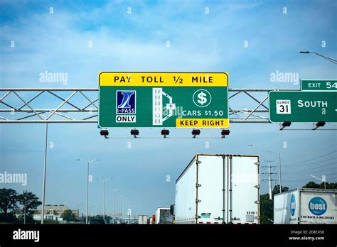 Overhead directional lane signs for the electronic and manual collection of tolls on the freeway ...