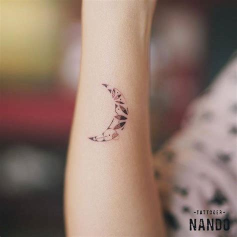 Small moon tattoo on the right wrist.