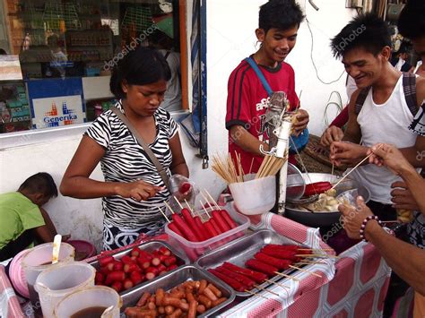 A street food vendor sells a variety of street food – Stock Editorial ...