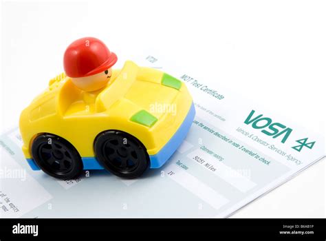 Toy car with MOT certificate Stock Photo - Alamy