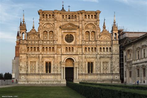 a large building with many windows and towers on it's sides, in front ...