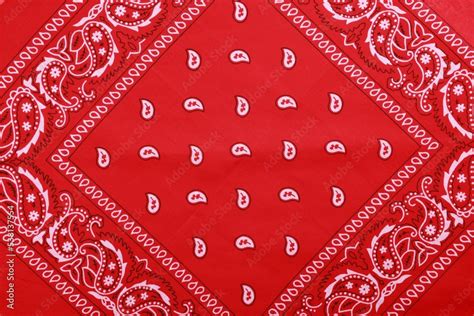 Top view of red bandana with paisley pattern as background Stock Photo ...