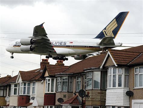 Is this Britain's noisiest street? Hundreds of aircraft soar just 40ft above rooftops of Myrtle ...