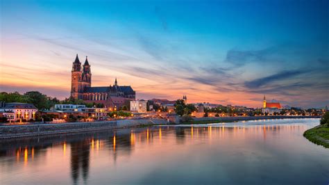 Magdeburg, Germany. Panoramic cityscape image of Magdeburg, Germany with reflection of the city ...