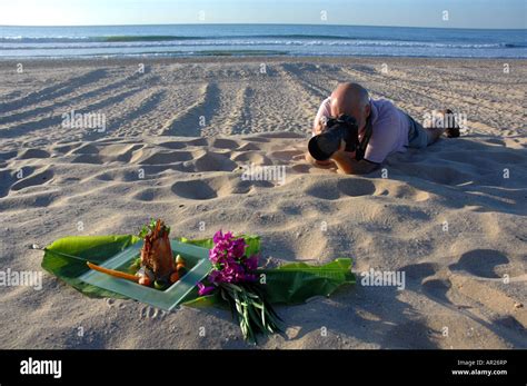 Food photographer photographing food on a beach Stock Photo - Alamy