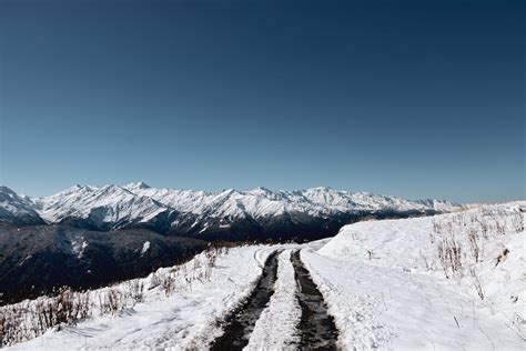 Snow Covered Road Near Mountain · Free Stock Photo