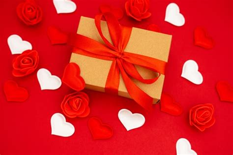 Premium Photo | Valentine's day gift box of kraft paper with a red ...