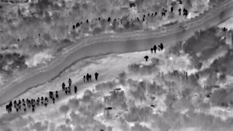 Footage shows migrants walking around border wall to enter US | Fox News