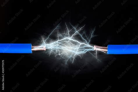 Electrical spark between two insulated copper wires Stock Photo | Adobe Stock