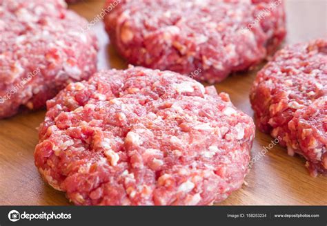 Organic raw ground beef, round patties for making homemade burger on ...