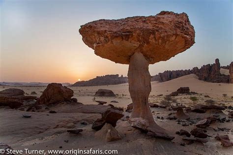 Sunrise over the spectacular Ennedi Plateau. Rising from the sands of ...