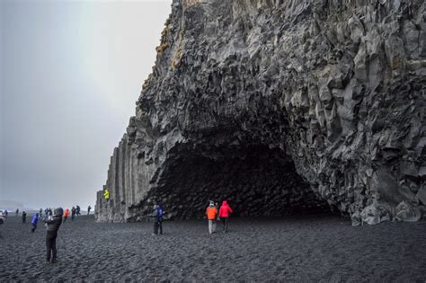 Standing On Reynisfjara Beach's Black Sand At Vik In Iceland | Ambition Earth