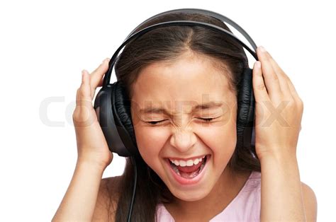 The girl islistening to loudly music | Stock image | Colourbox