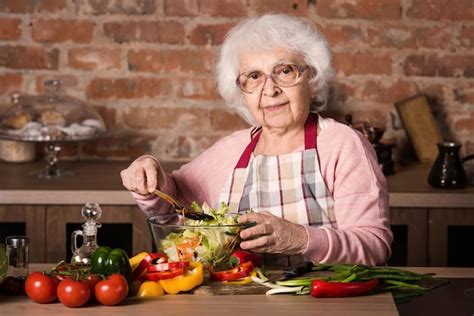 Premium Photo | Senior woman cooking