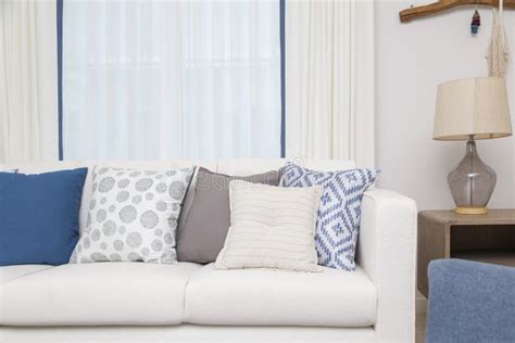 White Sofa with Many Blue Pillows in Cozy Living Room Stock Image - Image of lounge, blue: 170601195