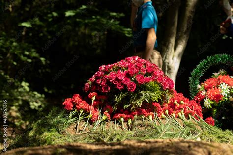 Flowers on grave. Military lay flowers on grave of soldier. Details of ceremony. Stock Photo ...