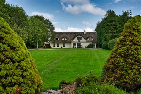 Premium Photo | Fully restored old thatched roof cottage