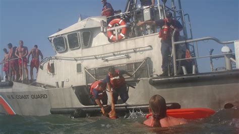 Coast Guard, beach patrol rescue person from rip current