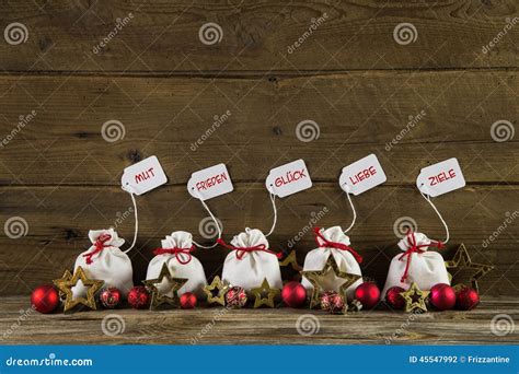 German Christmas Greetings With Presents And Text On Wooden Back Stock ...