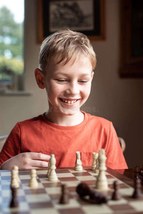 Young White Child Playing a Game of Chess on Large Chess Board. Chess ...
