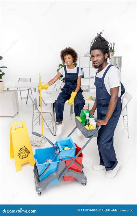 Cheerful African American Cleaners Holding Cleaning Equipment and ...