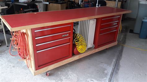 Rolling work bench made to incorporate tool chest with open clamp and extension cord storage ...