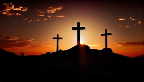 Premium Photo | Three wooden crosses stand on a hill at sunset ...