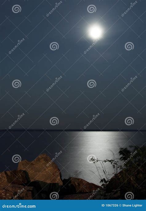 Moonlit Lake stock photo. Image of boat, fish, moon, rock - 1067326