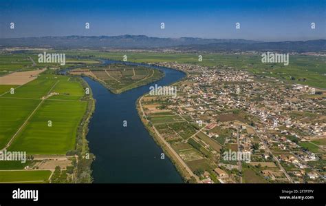 Aerial view of the town of Deltebre and the Ebro river in the Ebro ...